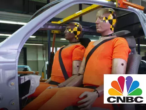 Two crash test dummies in car frame