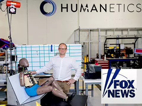 CMO Barney Loehnis with a child crash test dummy in Humanetics lab