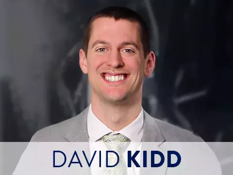 Headshot of David Kidd with black background