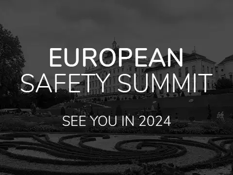 European Safety Summit, see you in 2024. Black and white image of German garden in background
