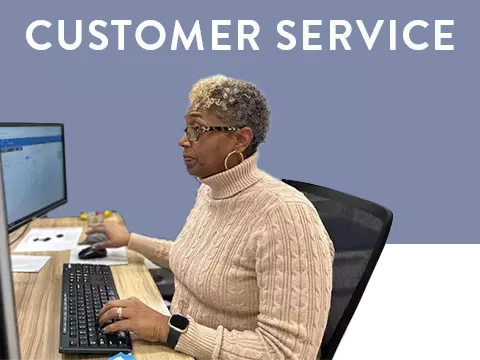 Customer service representative working at computer