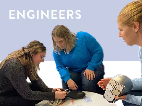 Group of female engineers collaborating at table