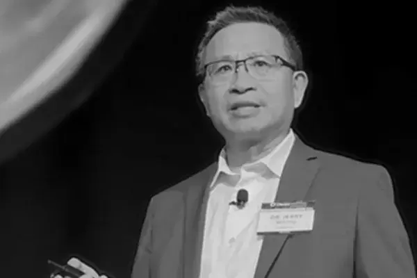 Dr. Jerry Wang speaking at a conference