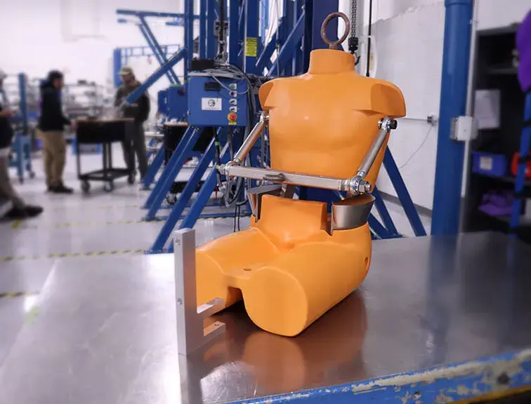A FAD 1 crash test dummy in a test lab