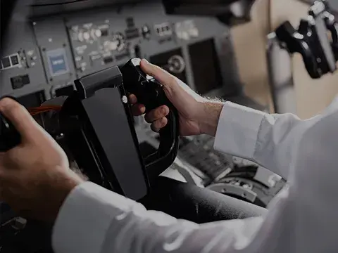 Pilot in cockpit flying an airplane
