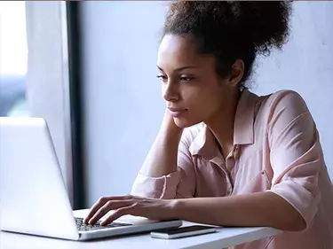 woman looking at laptop