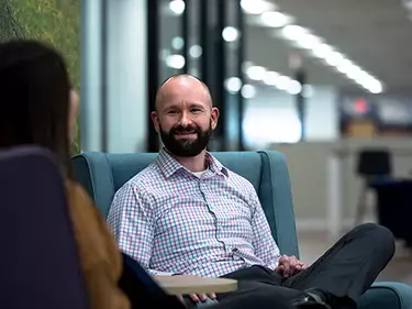 man talking to woman