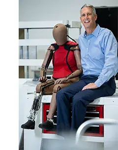 Humanetics CEO, Chris O'Connor, posing with THOR-5F